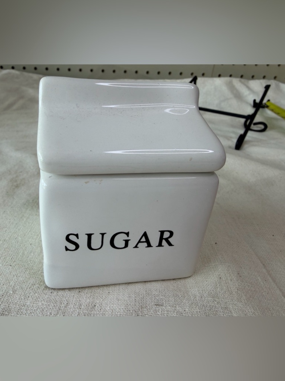 Cost Plus World Market White Ceramic Canister with Black Logo